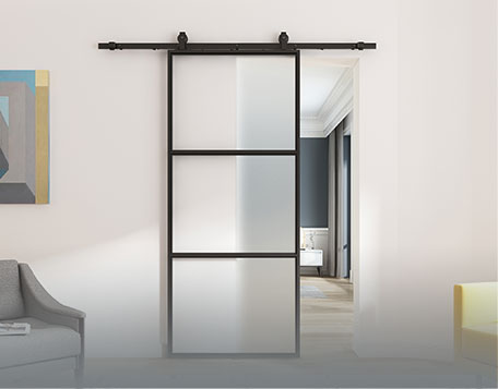 Modern sliding barn door with frosted glass panels in a contemporary interior setting.