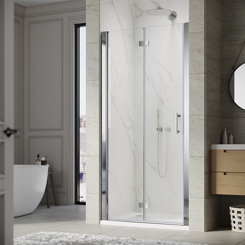 Modern bathroom with marble shower enclosure, wooden vanity, and plush white rug in a naturally lit room.