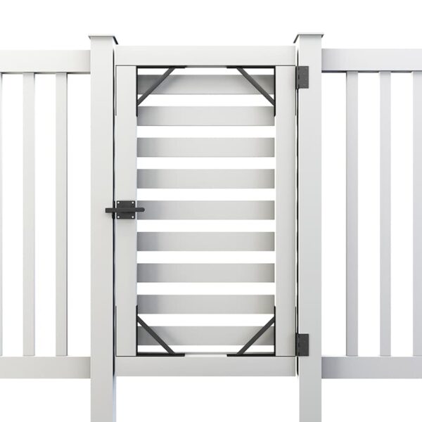 A white slatted gate with black hardware, including a latch and hinges, is centered between two white slatted fence panels.