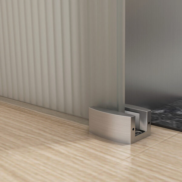 Modern pop-up outlet by a sliding glass door on a wooden floor offers easy power access in a sleek setting.