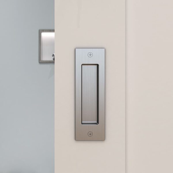 Bathroom entry door with soft-close, wood cover, and top mount on a gray wall, lit by a white chevron nearby.