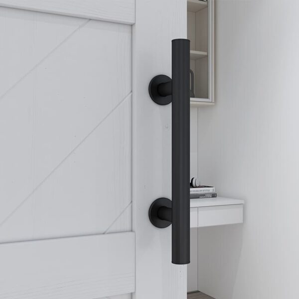 Modern black vertical door handle on a 36in x 84in Knocked Down Version Chevron Barn Door, with a small white shelf and books in the background.