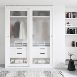 A Glass Sliding Closet Door with frosted panels shows clothes and drawers. A white shelf to the right holds books and decor.