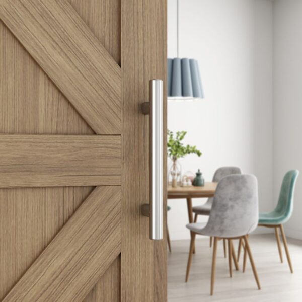 Close-up of a partly opened wooden sliding door with Stainless Steel Brushed Finish Barn Door Handle, revealing a dining area.