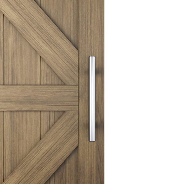 A wooden door with diagonal planks features a brushed steel barn handle for sliding doors, adding rustic charm.