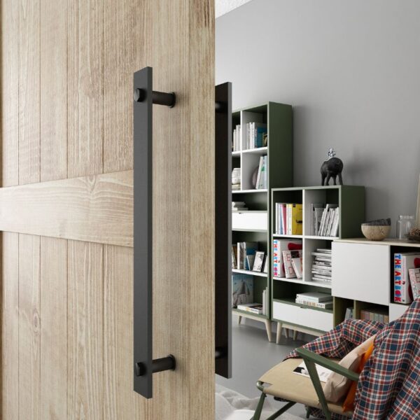 A wooden sliding barn door with a vintage handle is ajar, revealing a modern room with shelves, books, and an elephant statue.