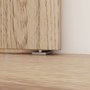 Close-up of an adjustable cabinet foot on light wood flooring, matching the Brushed Nickel Floor Guide for sliding barn doors.