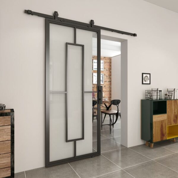 A sleek black steel-framed sliding glass barn door with frosted glass enhances the space, complementing the tiled floor and dining area.