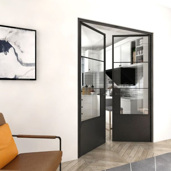 A modern kitchen with a swinging black steel glass barn door features a herringbone floor, abstract art, and cozy seating.