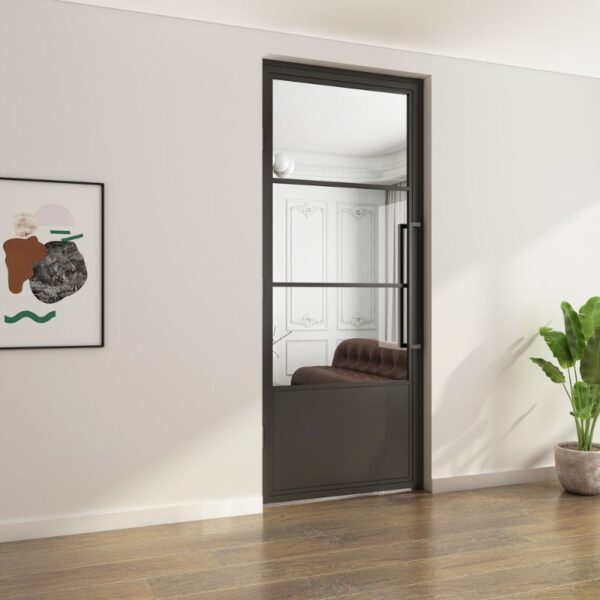 A modern room with a sleek Black Powder Coated Swing Glass Door, customizable and stylish, features framed art, a brown sofa, and a plant.