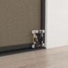 Close-up of a bottom bracket on wood floor for a 48" Arch Closet Door, featuring a metal frame and roller mechanism.