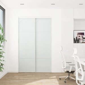 A modern white office with a desk, compact chair, plant by the window, and framed art. The 48" arch closet door seamlessly fits in.