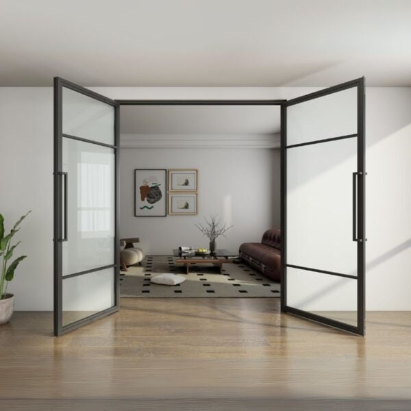 Steel-framed glass doors open to a minimalist living room with low table, floor cushions, art, and a potted plant.