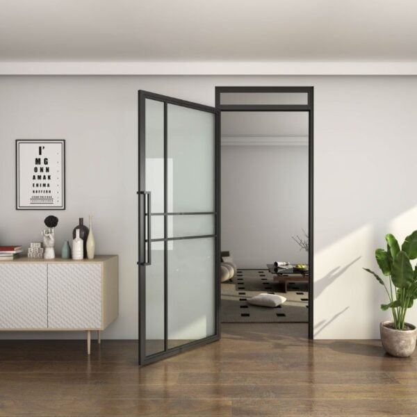 Black steel & glass door with fanlight stands open to a minimalist room with sideboard, decor, plant, and light wall.