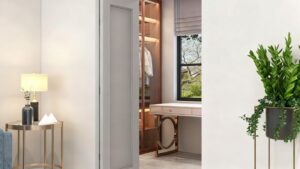 Luxurious modern walk-in closet with elegant wooden wardrobe and contemporary vanity desk featuring stylish design elements and natural lighting for sophisticated home organization.