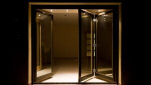 Versatile glass door opening to modern interior space, enhancing natural light and aesthetic appeal for residential or commercial environments.