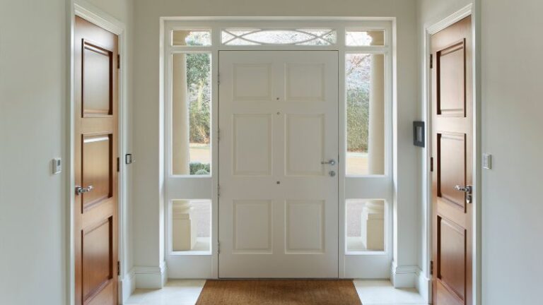 Elegant white front door with glass panels and wooden accents, ideal for American residential architecture, emphasizing durability and aesthetic appeal.