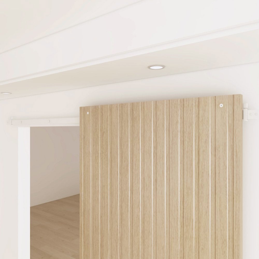 Contemporary wooden sliding door with vertical panels in a minimalist interior setting.