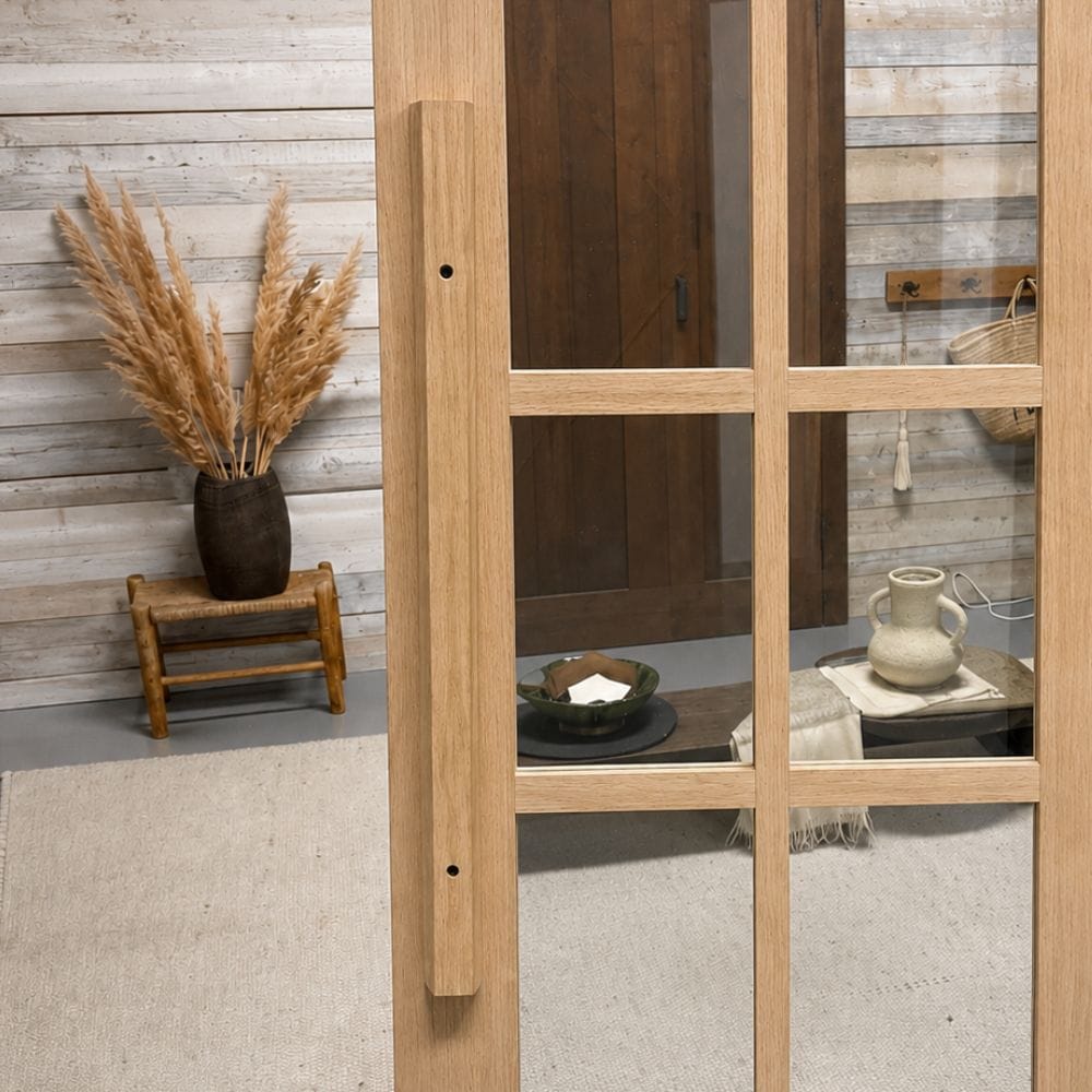 Elegant wood and glass pivot doors with hardware set, showcasing modern design and craftsmanship for stylish interior or exterior entryways.