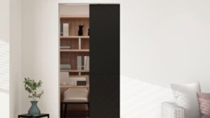 Contemporary bedroom with a sleek black sliding door separating the sleeping area from the closet.