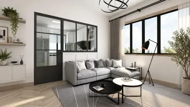 Bright living room featuring a glass partition, large windows, and contemporary furniture, emphasizing space optimization and stylish design.