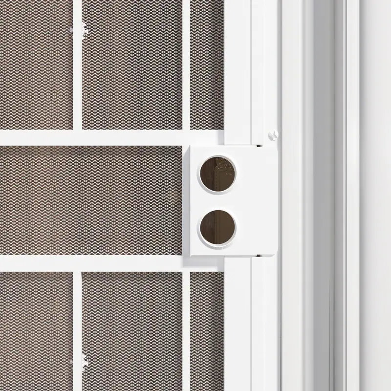 Close-up of a white surface mount steel security door featuring expanded metal screen for enhanced security and ventilation.