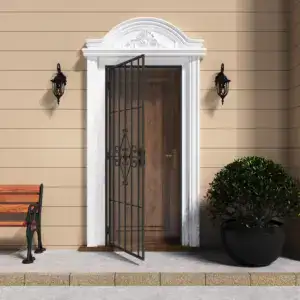 Black outswing steel security door with decorative scrollwork and metal mesh, installed on a beige house exterior with wall-mounted lanterns and a potted plant.