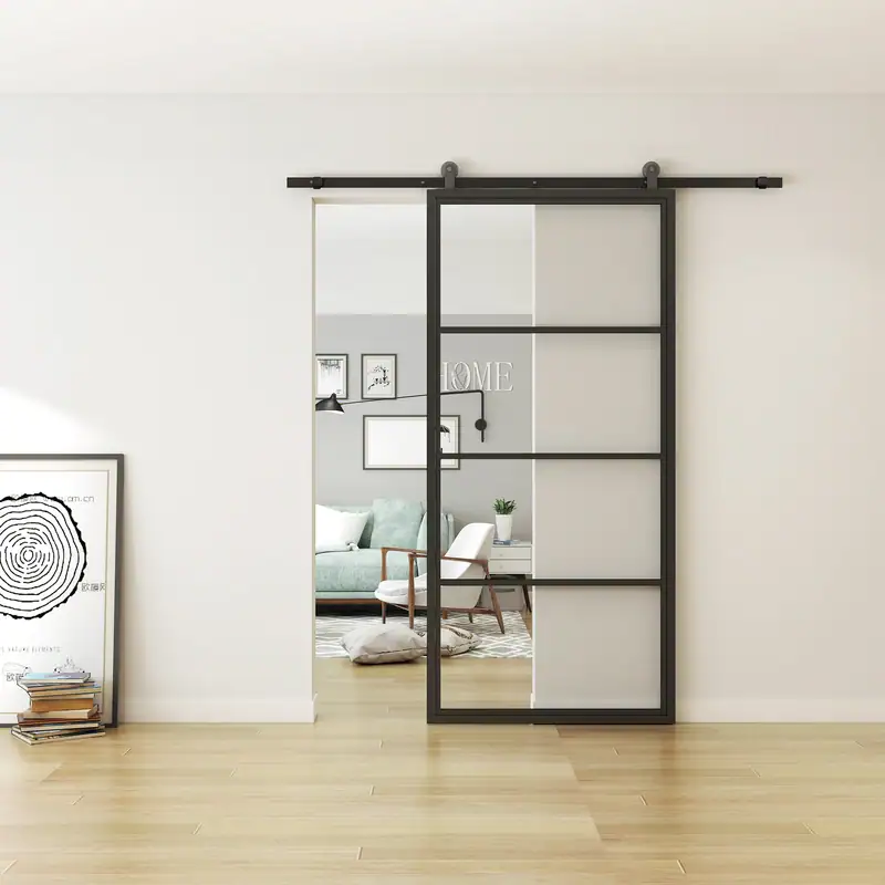 Modern 4-lite black steel sliding barn door with glass panels for interior decor.