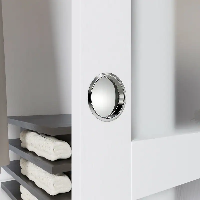 Close-up of a modern frosted glass closet door with a sleek round handle, part of a contemporary wardrobe setup.